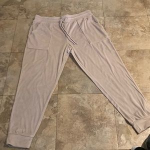 the color is a soft pink it is a soft/fluffy which is a pear of pj pants